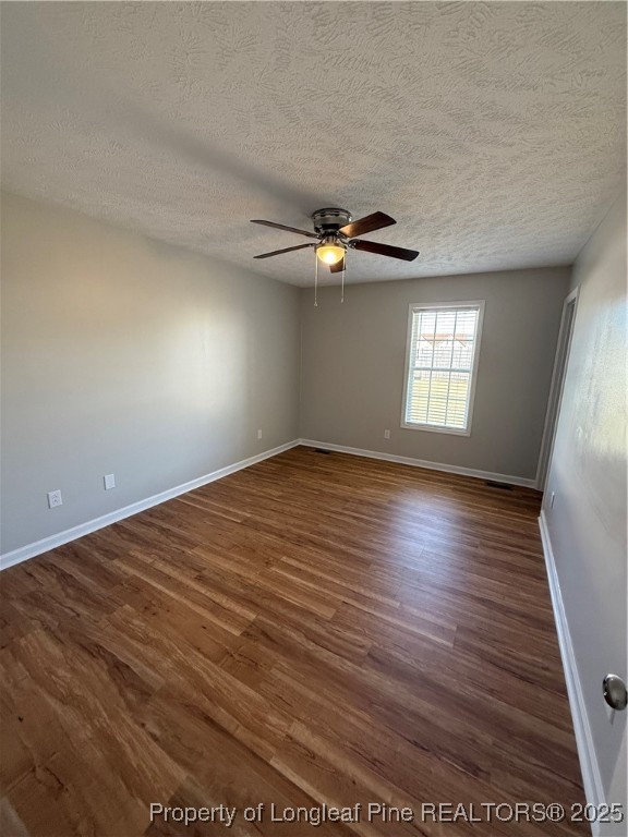 31 Buckboard Lane Autryville, NC 28318 - Photo 17 of 32 an empty room with wooden floor and windows