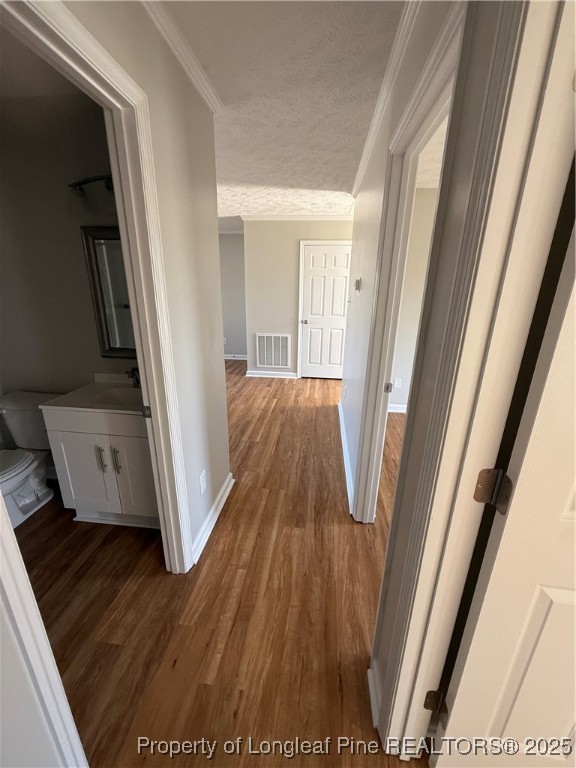 31 Buckboard Lane Autryville, NC 28318 - Photo 20 of 32 a view of a hallway with wooden floor and staircase