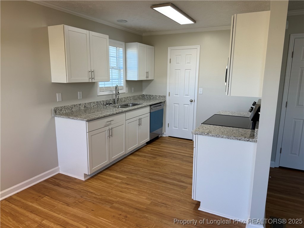 31 Buckboard Lane Autryville, NC 28318 - Photo 8 of 32 a kitchen with granite countertop white cabinets and white appliances