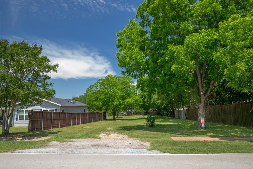 1000 Hughes Road Grapevine, TX 76051 - Photo 3 of 15 a view of a yard with a house in the background