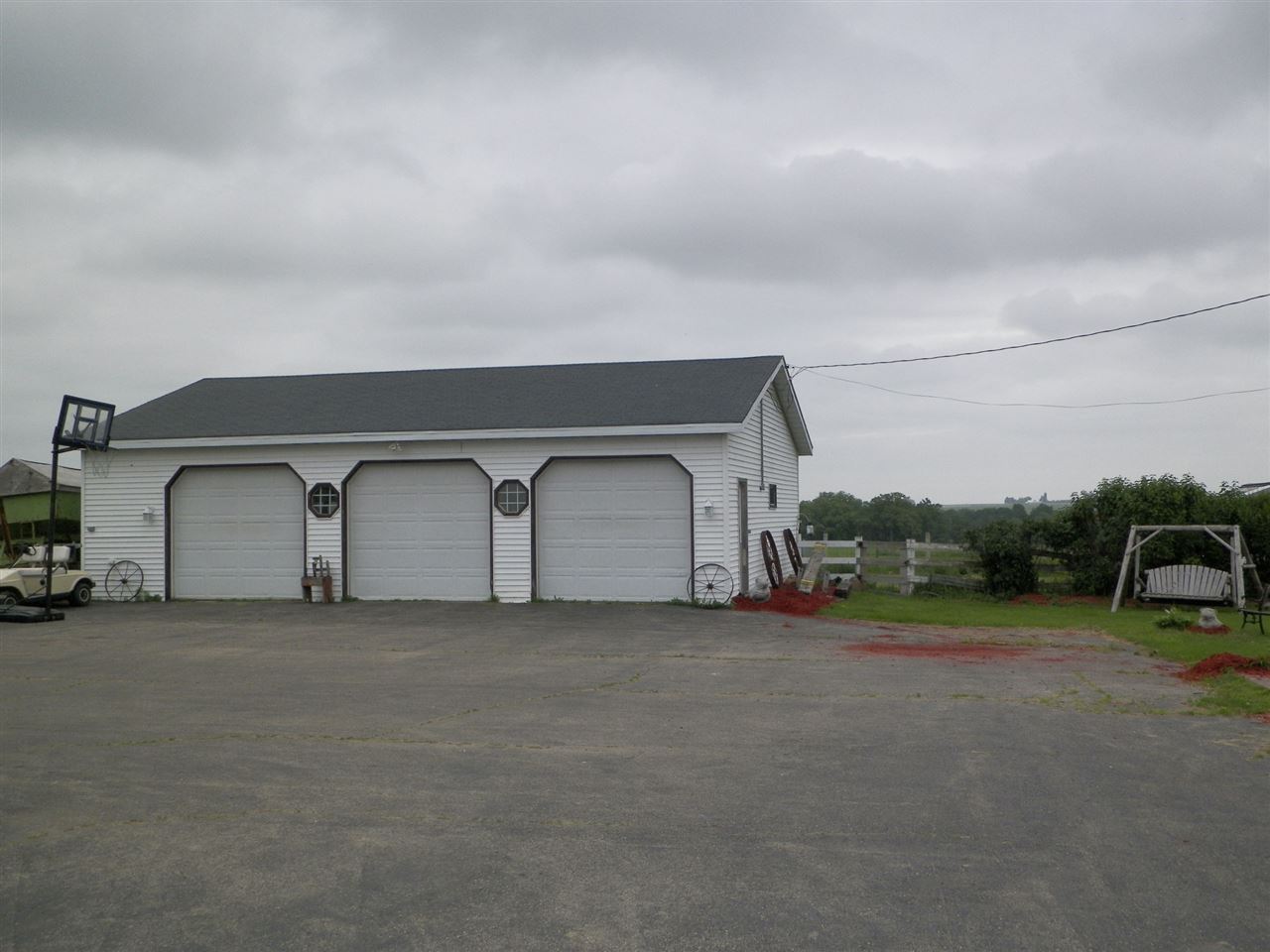 11483 North Tower Road Byron, IL 61010 - Photo 12 of 17 a car parked in front of a house