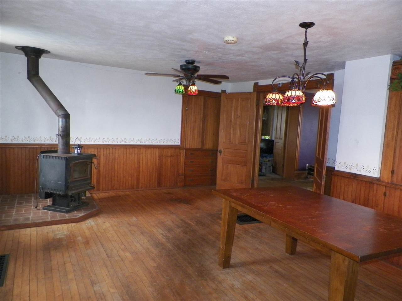 11483 North Tower Road Byron, IL 61010 - Photo 9 of 17 a room with table chair and wooden floor