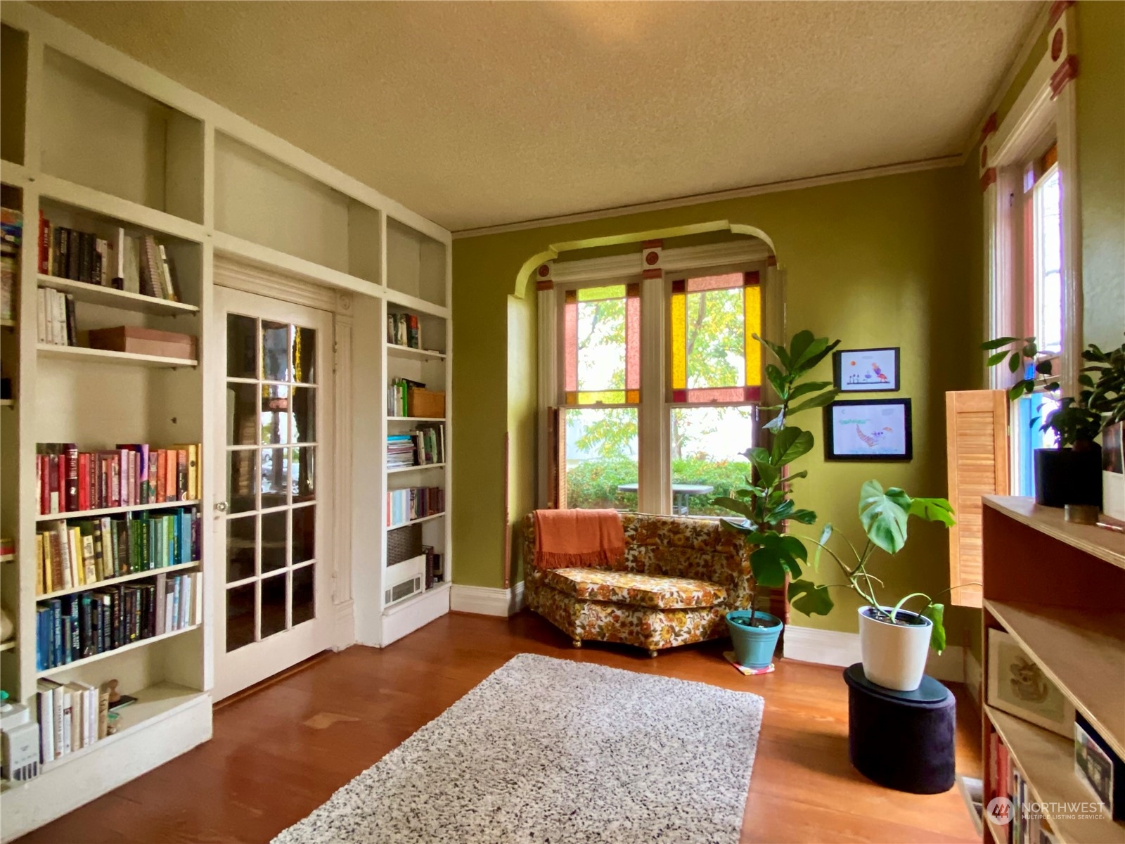 906 High Street Bellingham, WA 98225 - Photo 11 of 40 a living room with furniture and a book shelf