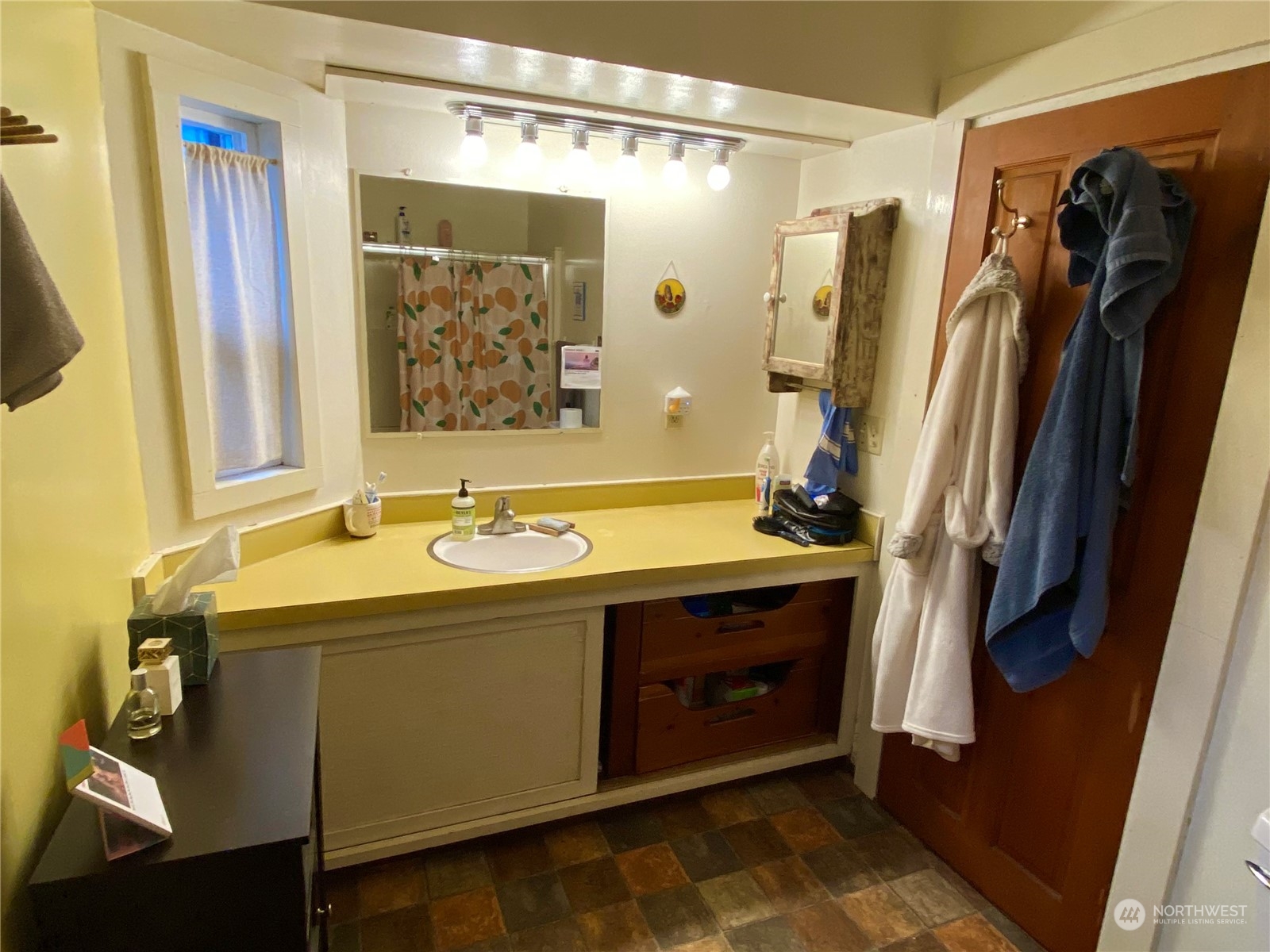 906 High Street Bellingham, WA 98225 - Photo 23 of 40 a bathroom with a granite countertop sink and a mirror