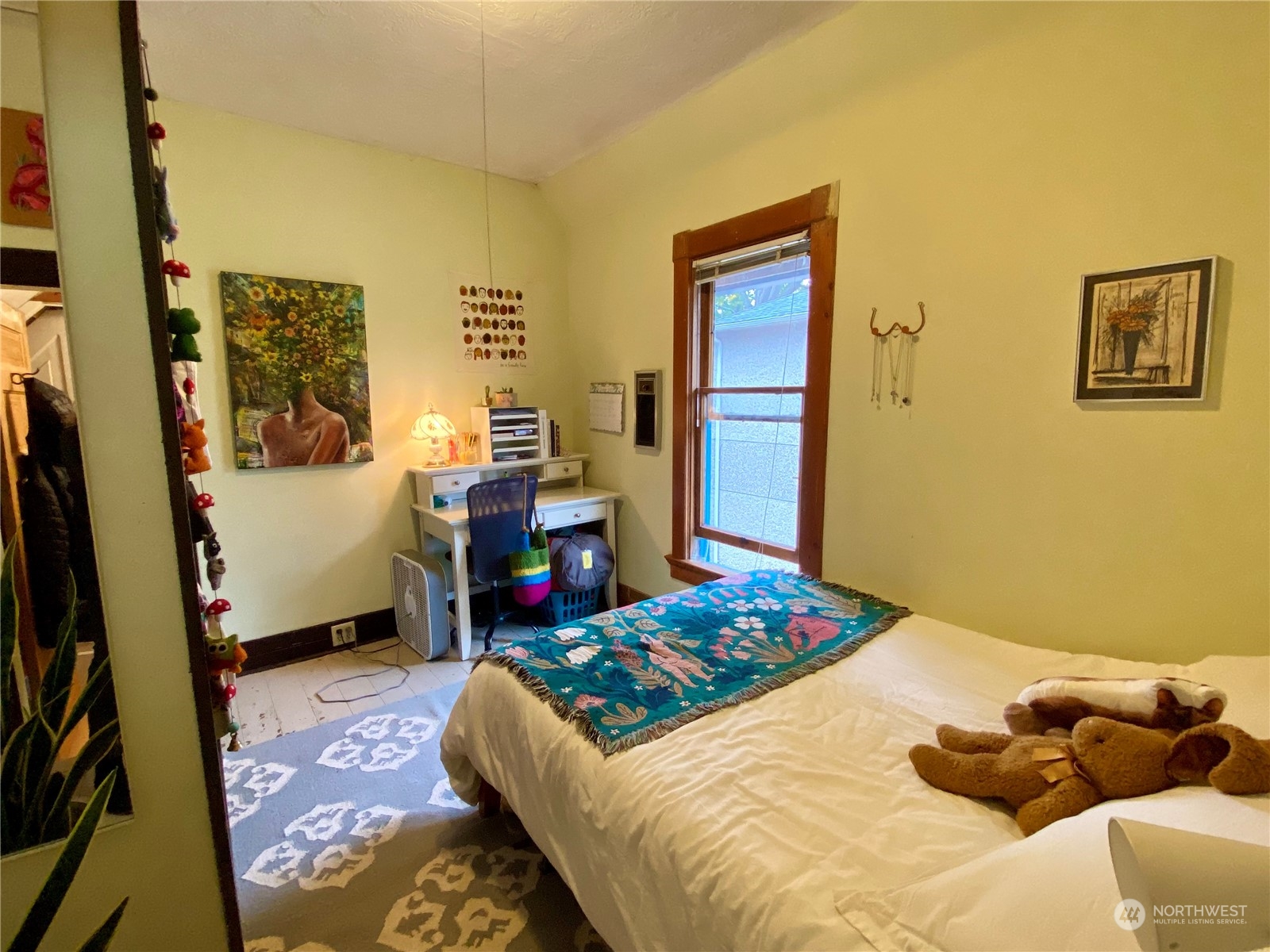 906 High Street Bellingham, WA 98225 - Photo 26 of 40 a bedroom with a bed and wooden floor