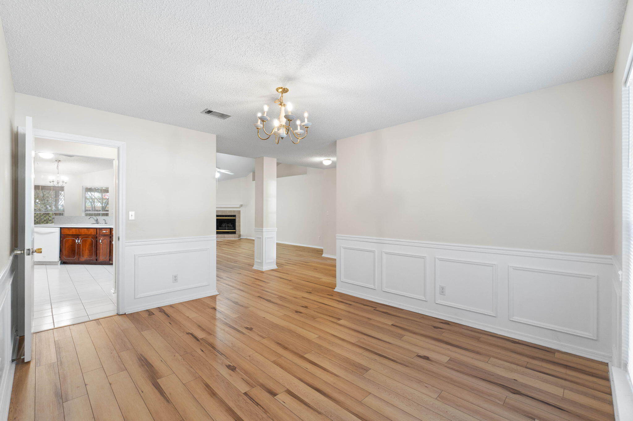 4591 Scarlet Drive Crestview, FL 32539 - Photo 16 of 37 wooden floor in an empty room with a window