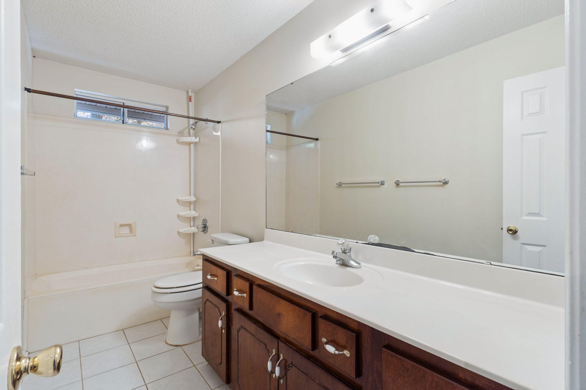 4591 Scarlet Drive Crestview, FL 32539 - Photo 20 of 37 a bathroom with a sink a toilet and shower