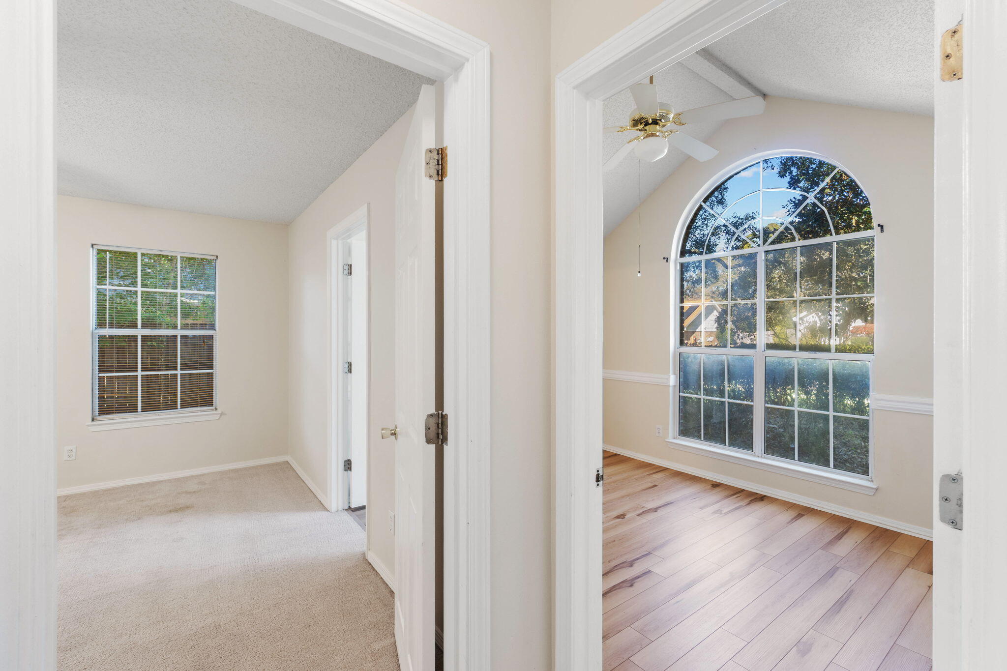 4591 Scarlet Drive Crestview, FL 32539 - Photo 24 of 37 an empty room with wooden floor and a window