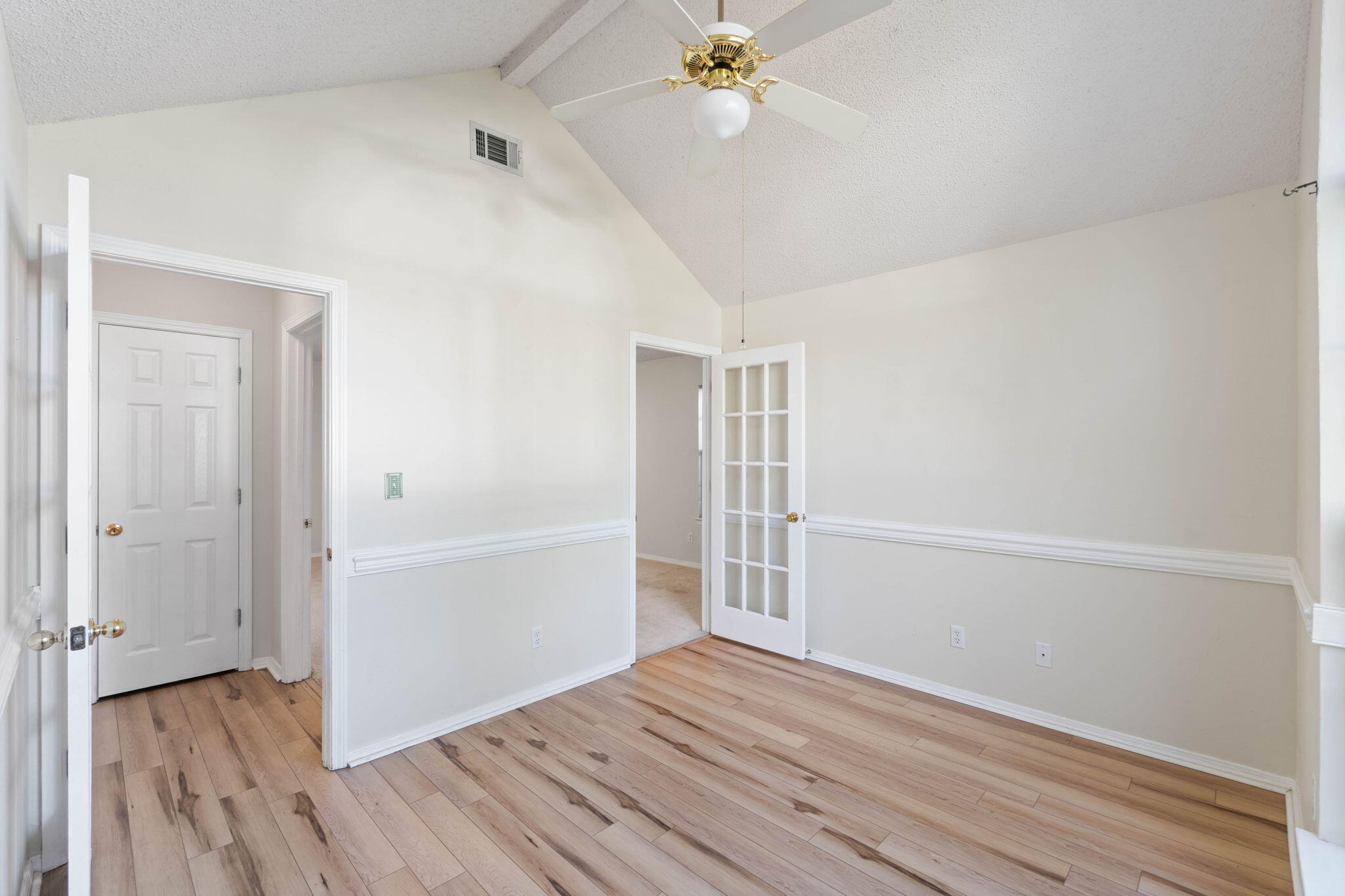 4591 Scarlet Drive Crestview, FL 32539 - Photo 26 of 37 an empty room with wooden floor closet and windows