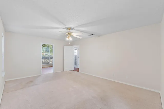 a bathroom with a double vanity sink a mirror and a bathtub