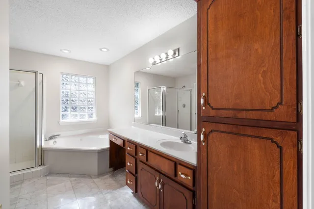 a bathroom with a glass shower door