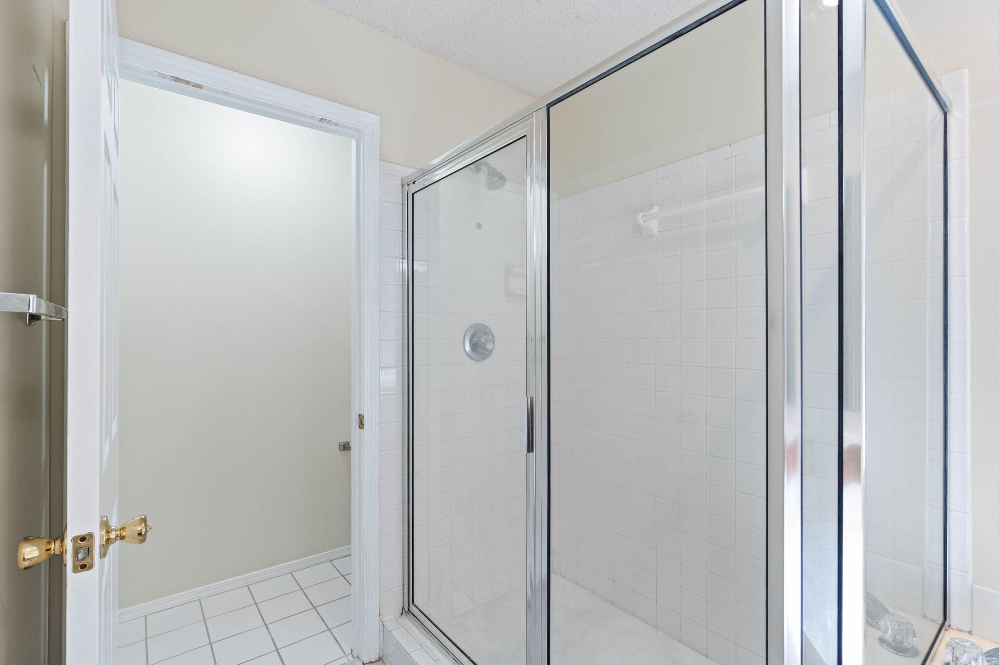 4591 Scarlet Drive Crestview, FL 32539 - Photo 30 of 37 a bathroom with a glass shower door