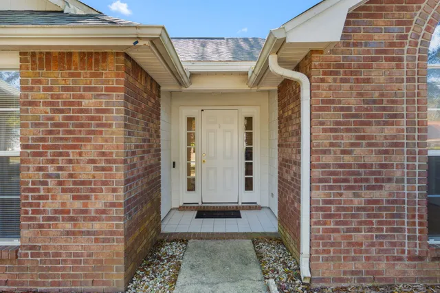 a view of a brick house with a door