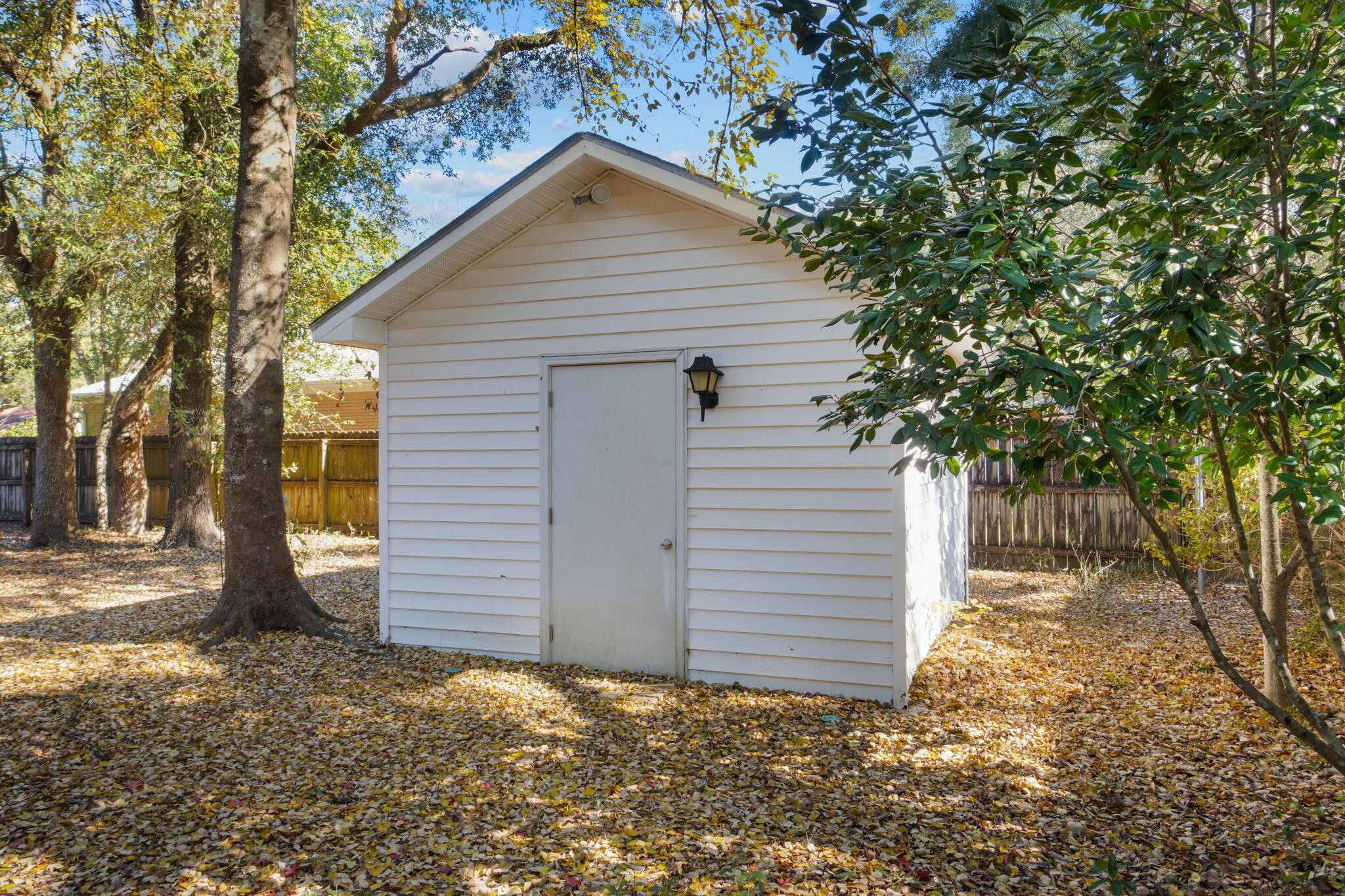 4591 Scarlet Drive Crestview, FL 32539 - Photo 37 of 37 a view of a small house with a tree in the background