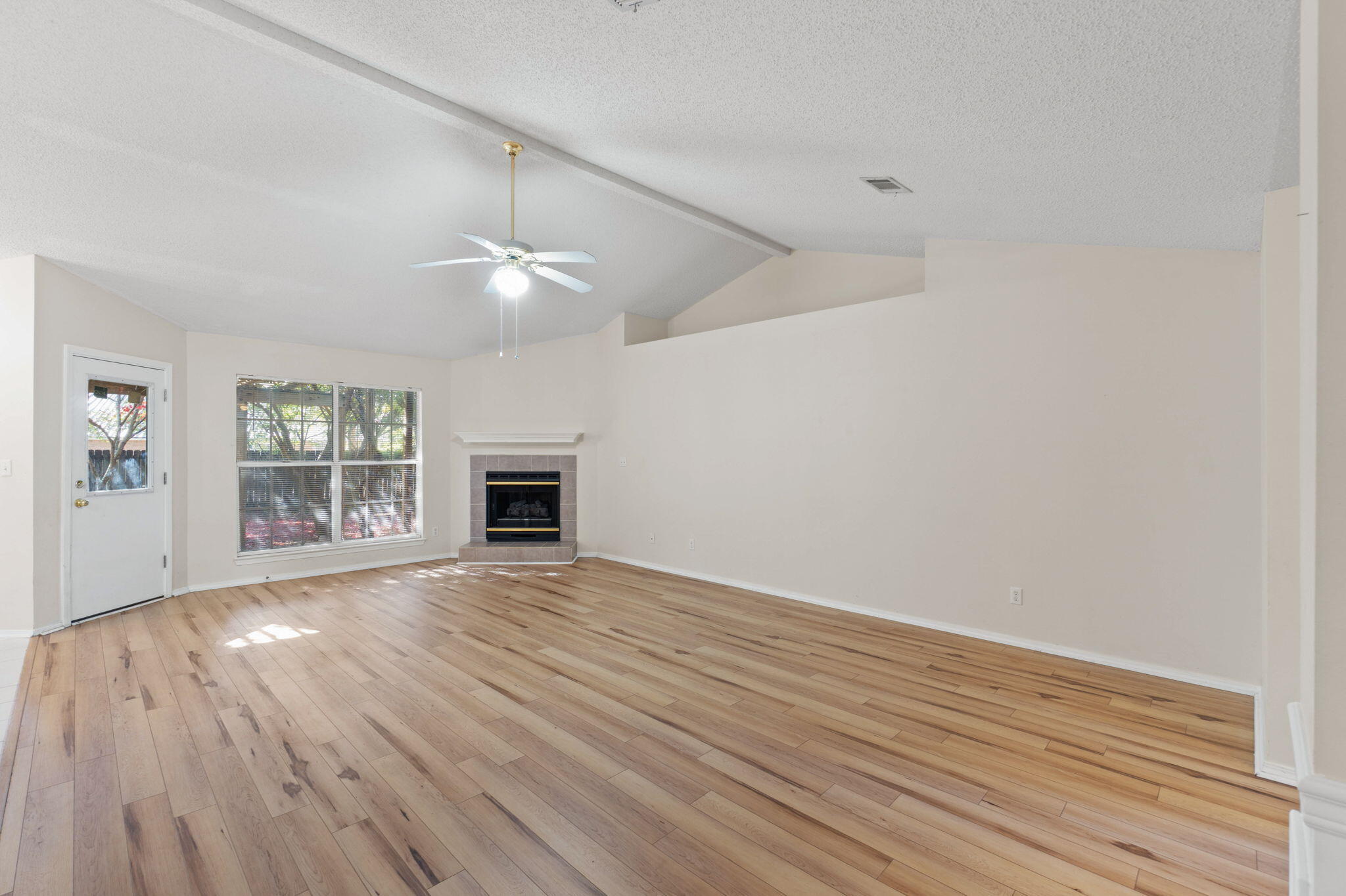 4591 Scarlet Drive Crestview, FL 32539 - Photo 7 of 37 wooden floor in an empty room with a window