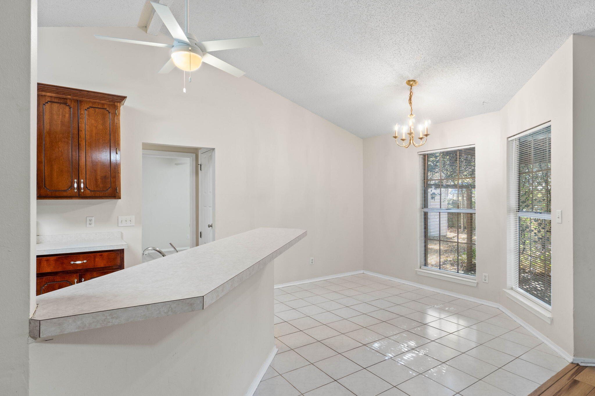 4591 Scarlet Drive Crestview, FL 32539 - Photo 10 of 37 a view of an empty room with window and cabinet