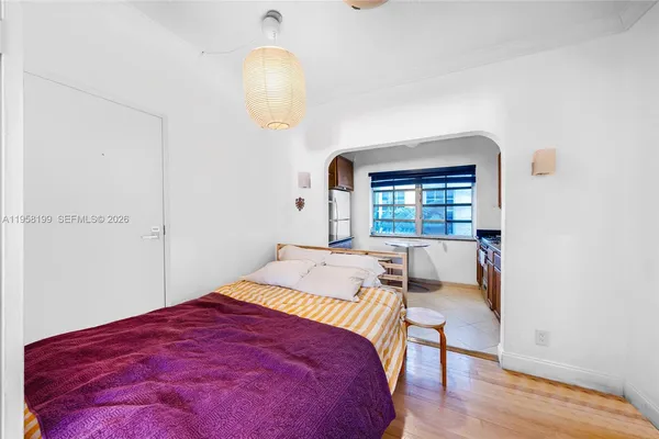 a bed room with a bed and a window