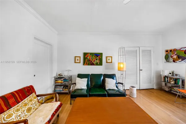 a living room with furniture rug and window