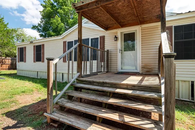 a view of backyard with deck