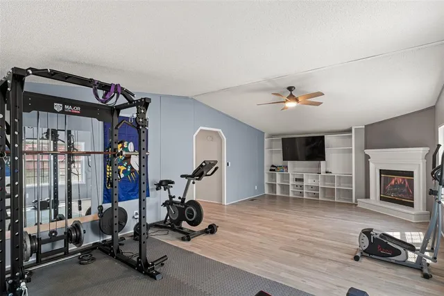 a view of a livingroom with furniture and a flat screen tv