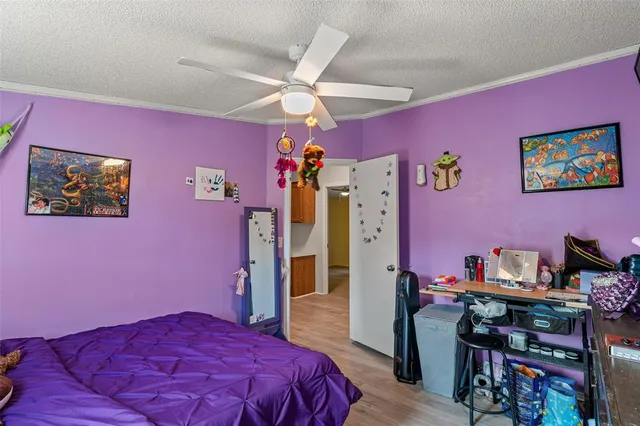 a bedroom with a bed closet and a mirror