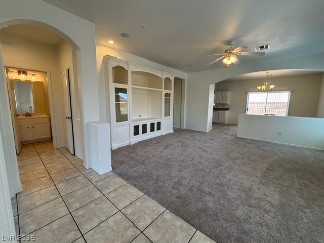 2866 Shimmering Bay Street Laughlin, NV 89029 - Photo 6 of 32 A built-in entertainment center anchors the family room, flowing into the kitchen and a well-appointed bathroom.