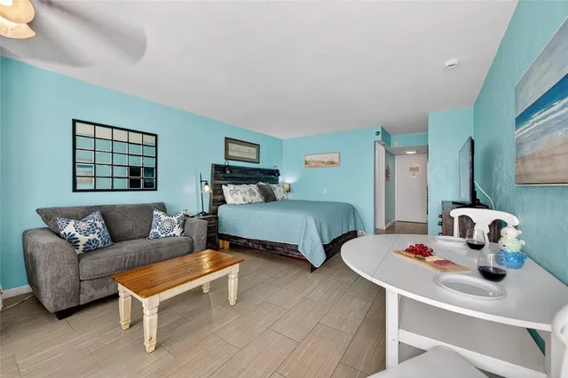 a bedroom with a bed and a chair