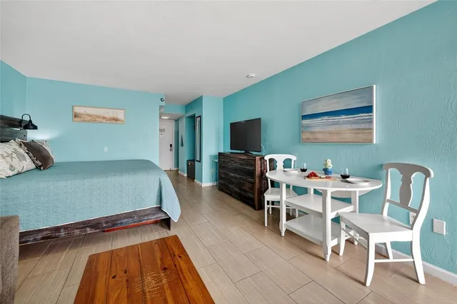 a bedroom with a bed and a chair