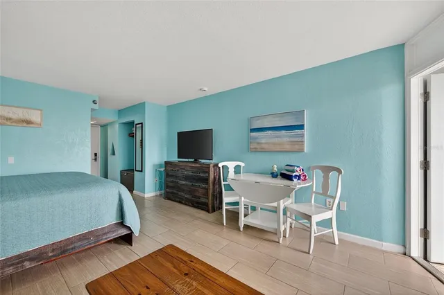 a bedroom with furniture and a window