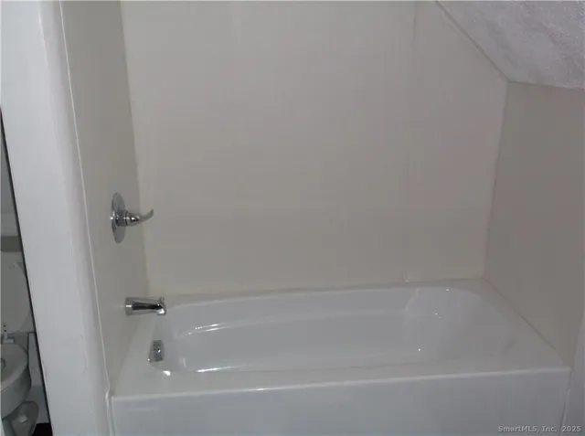a close view of a bathtub in bathroom