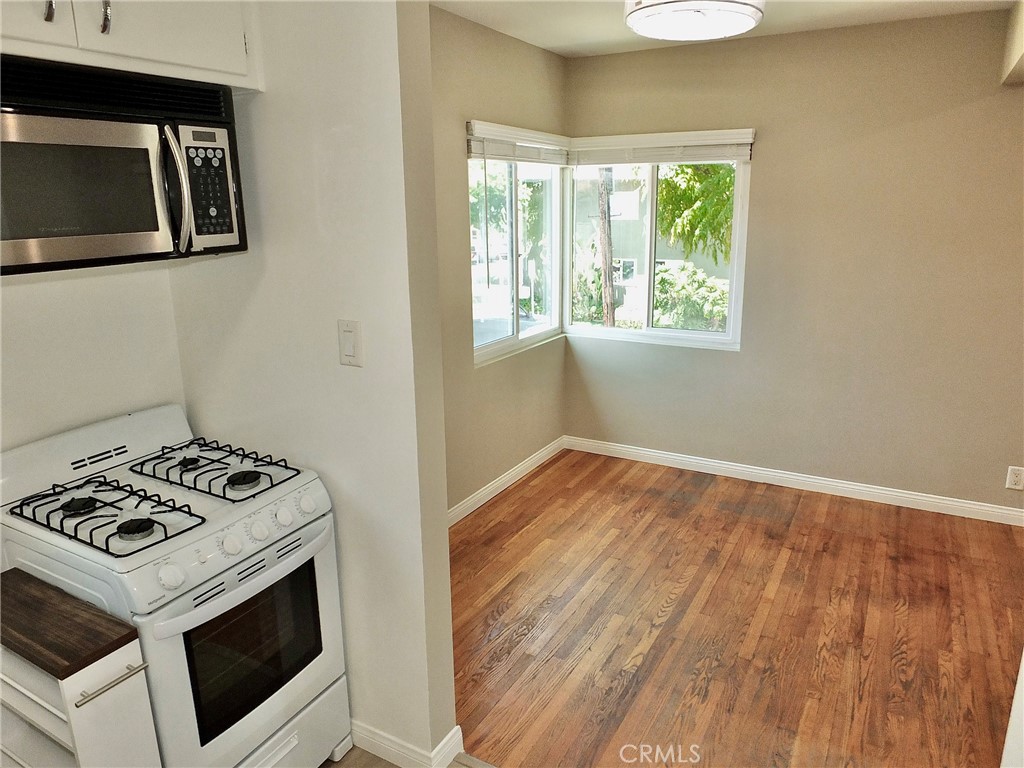 1808 East Appleton Street, Unit 7 Long Beach, CA 90802 - Photo 22 of 44 a kitchen with a stove and a microwave