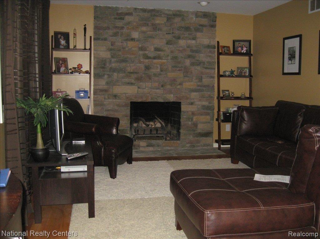 6548 Raintree Court Canton, MI 48187 - Photo 2 of 10 FAMILY ROOM WITH GAS F/P