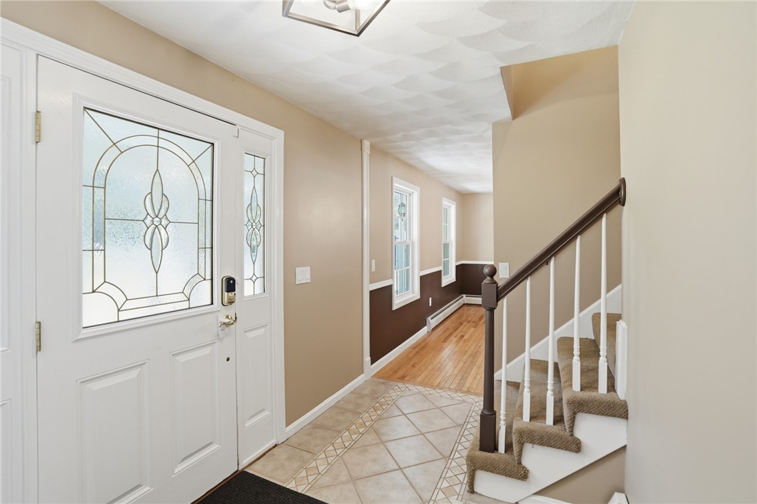 71 Rolling Hill Drive Exeter, RI 02822 - Photo 10 of 50 Front entrance leading into the dining room.
