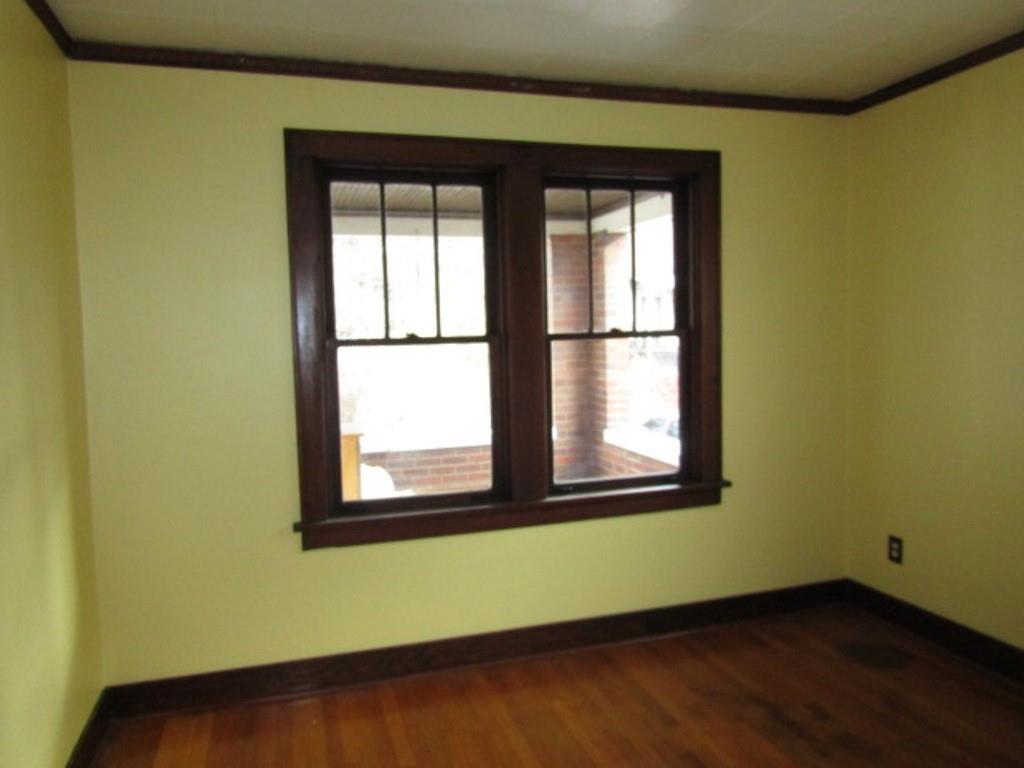 3825 Atkins Street Pittsburgh, PA 15212 - Photo 11 of 28 a view of a room that has wooden floor and a window