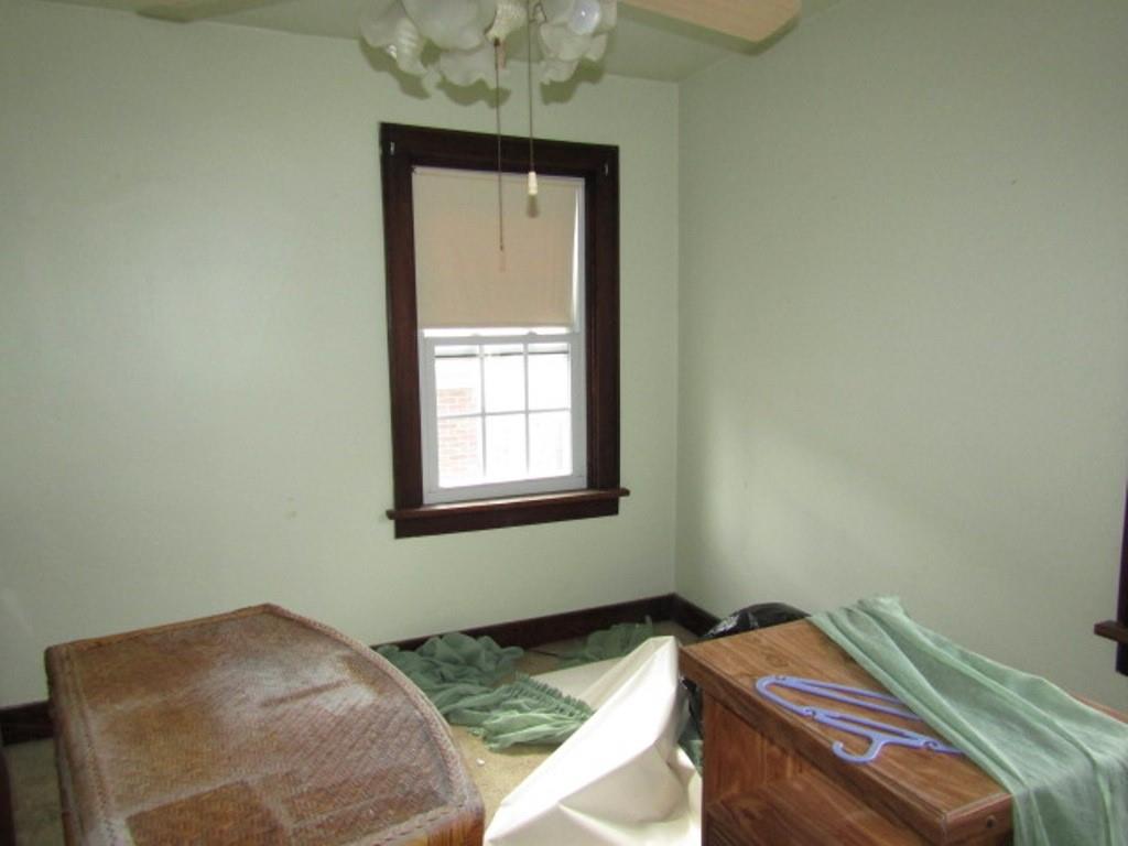 3825 Atkins Street Pittsburgh, PA 15212 - Photo 15 of 28 a bedroom with a bed and a window
