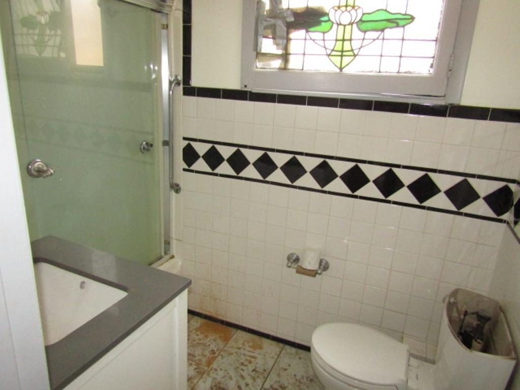 3825 Atkins Street Pittsburgh, PA 15212 - Photo 17 of 28 a bathroom with a sink a toilet and a shower