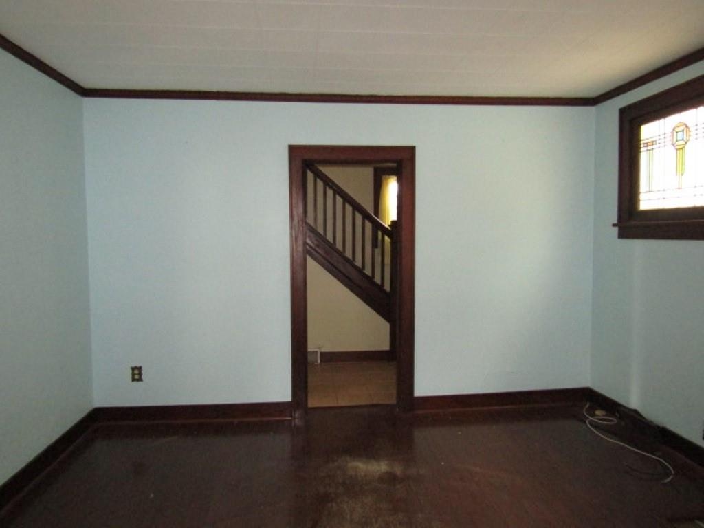 3825 Atkins Street Pittsburgh, PA 15212 - Photo 7 of 28 an empty room with wooden floor cabinet and windows