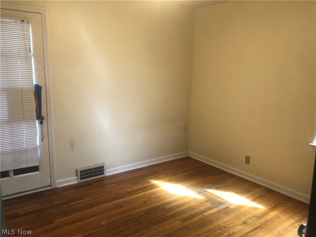4037 Wilmington Road Cleveland, OH 44121 - Photo 17 of 36 Unfurnished room with baseboards and hardwood / wood-style flooring