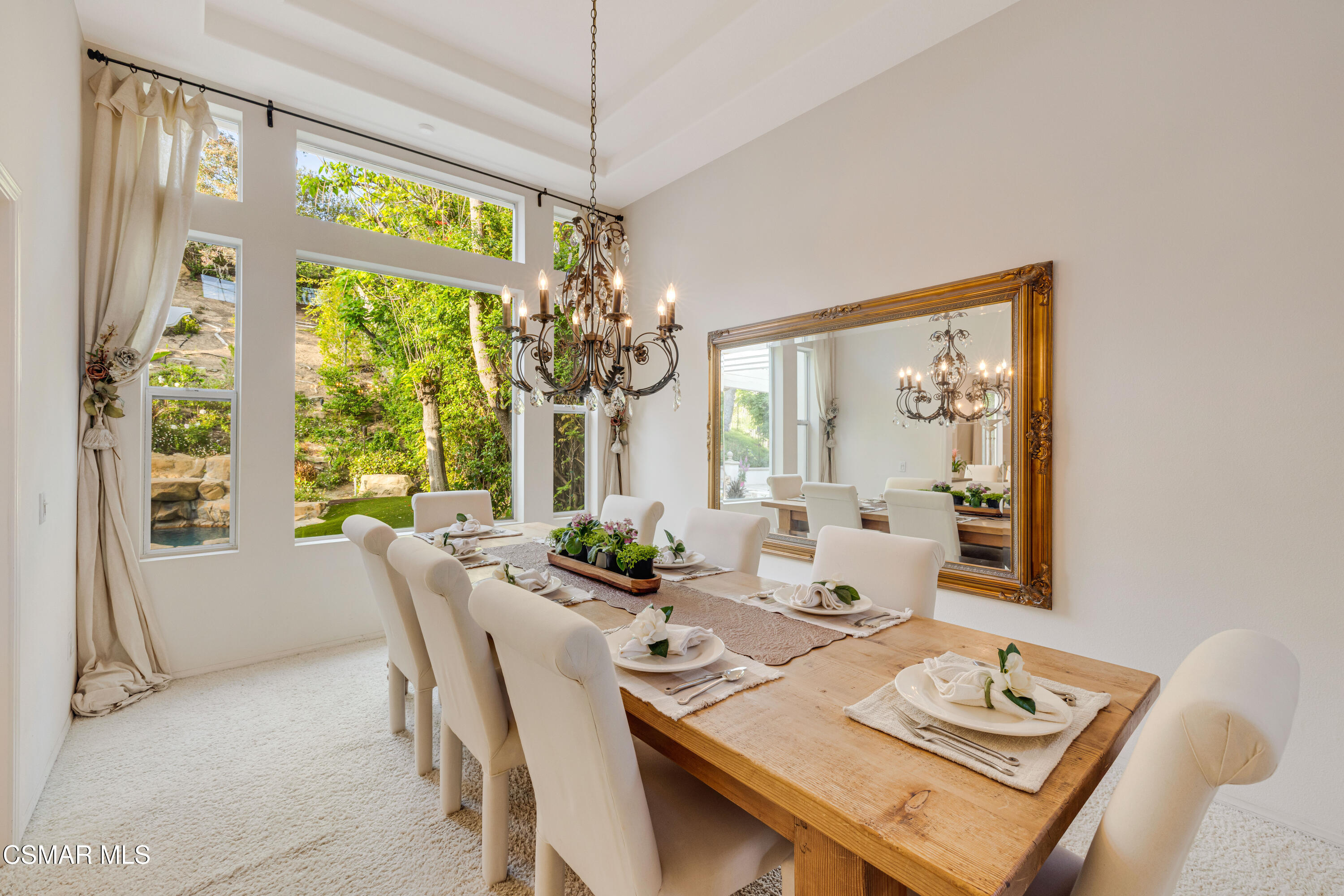 15633 Harte Lane Moorpark, CA 93021 - Photo 15 of 64 a view of a dining room with furniture a chandelier and large windows
