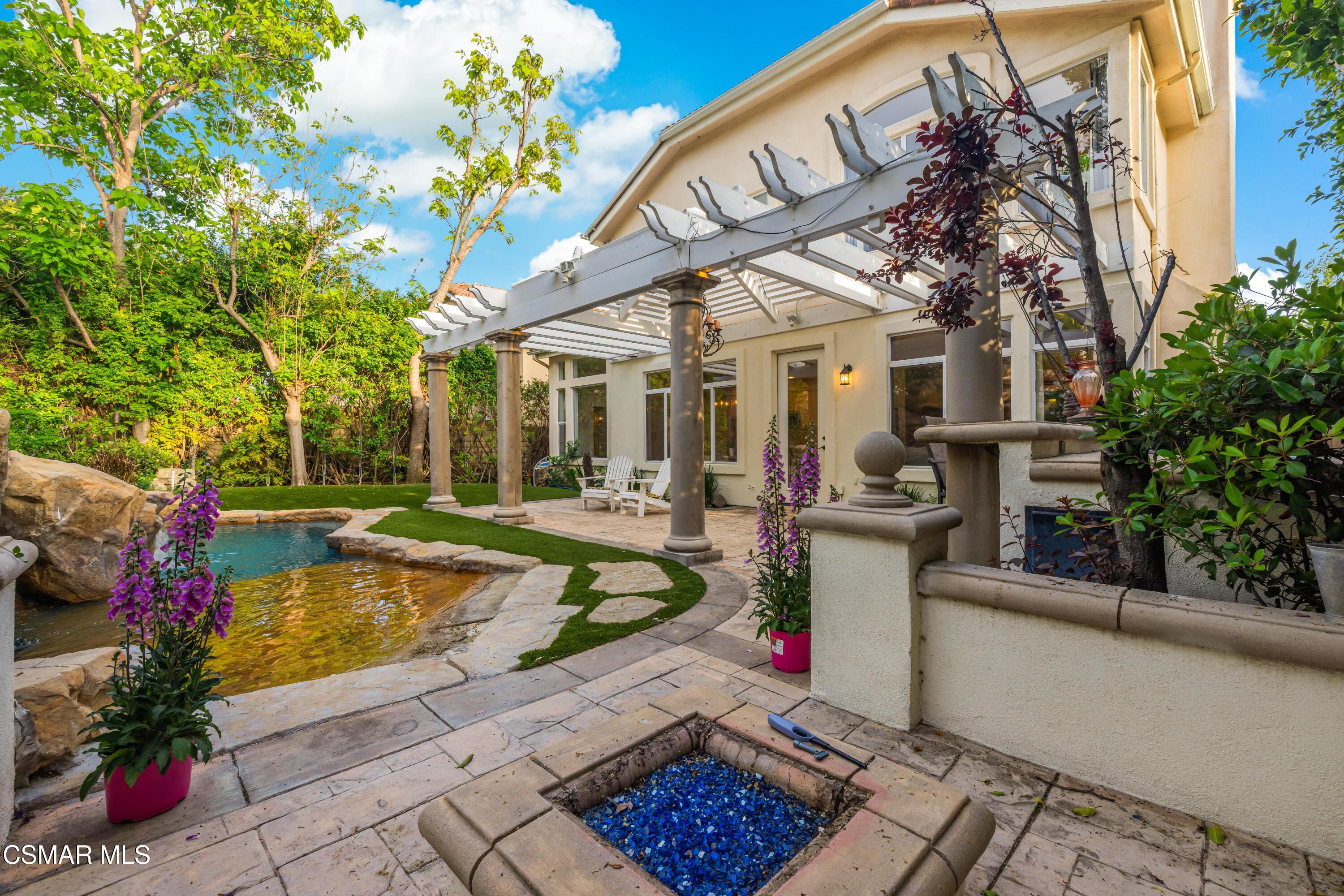 15633 Harte Lane Moorpark, CA 93021 - Photo 2 of 64 a view of a house with sitting area and garden