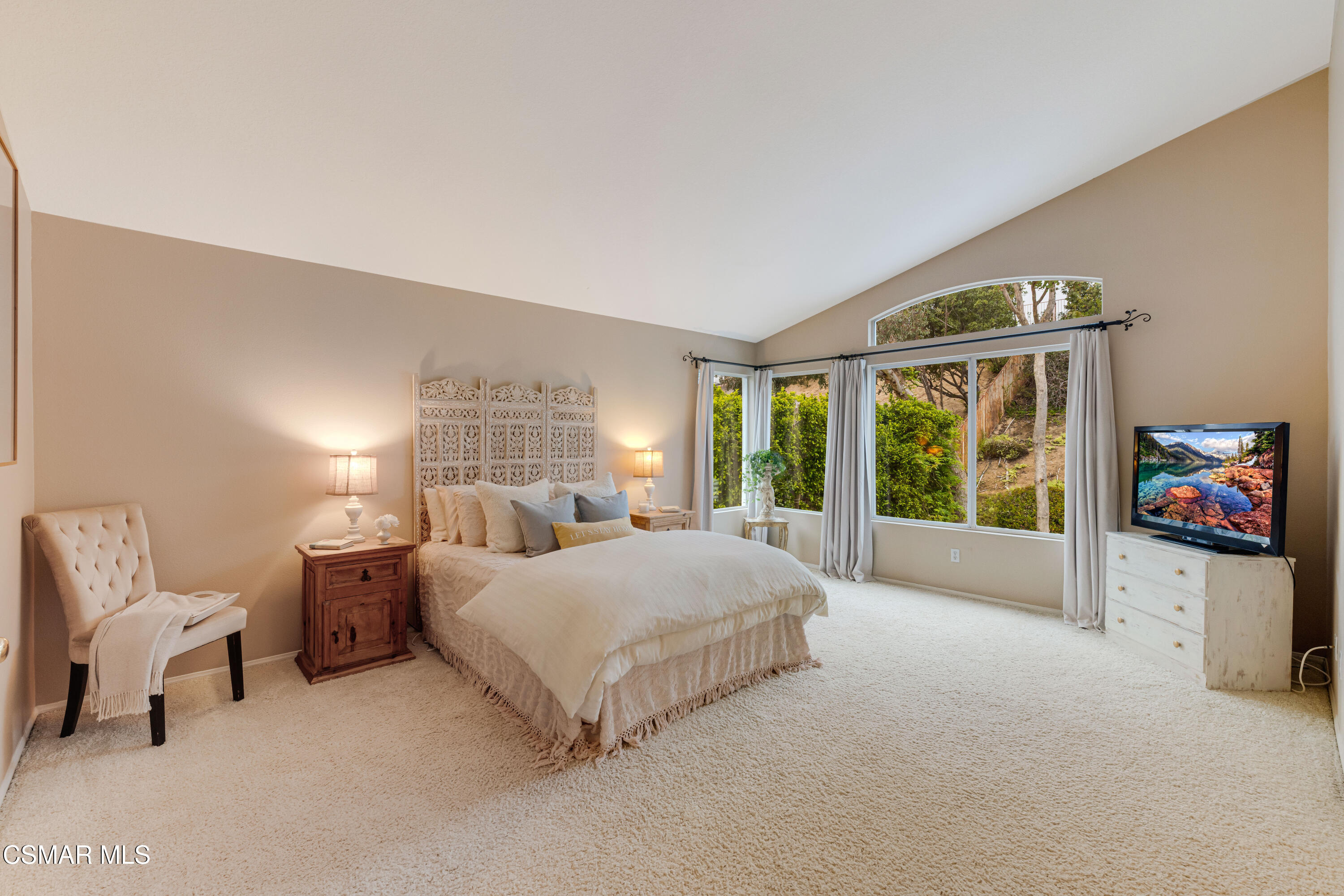 15633 Harte Lane Moorpark, CA 93021 - Photo 36 of 64 a spacious bedroom with a bed and glass window