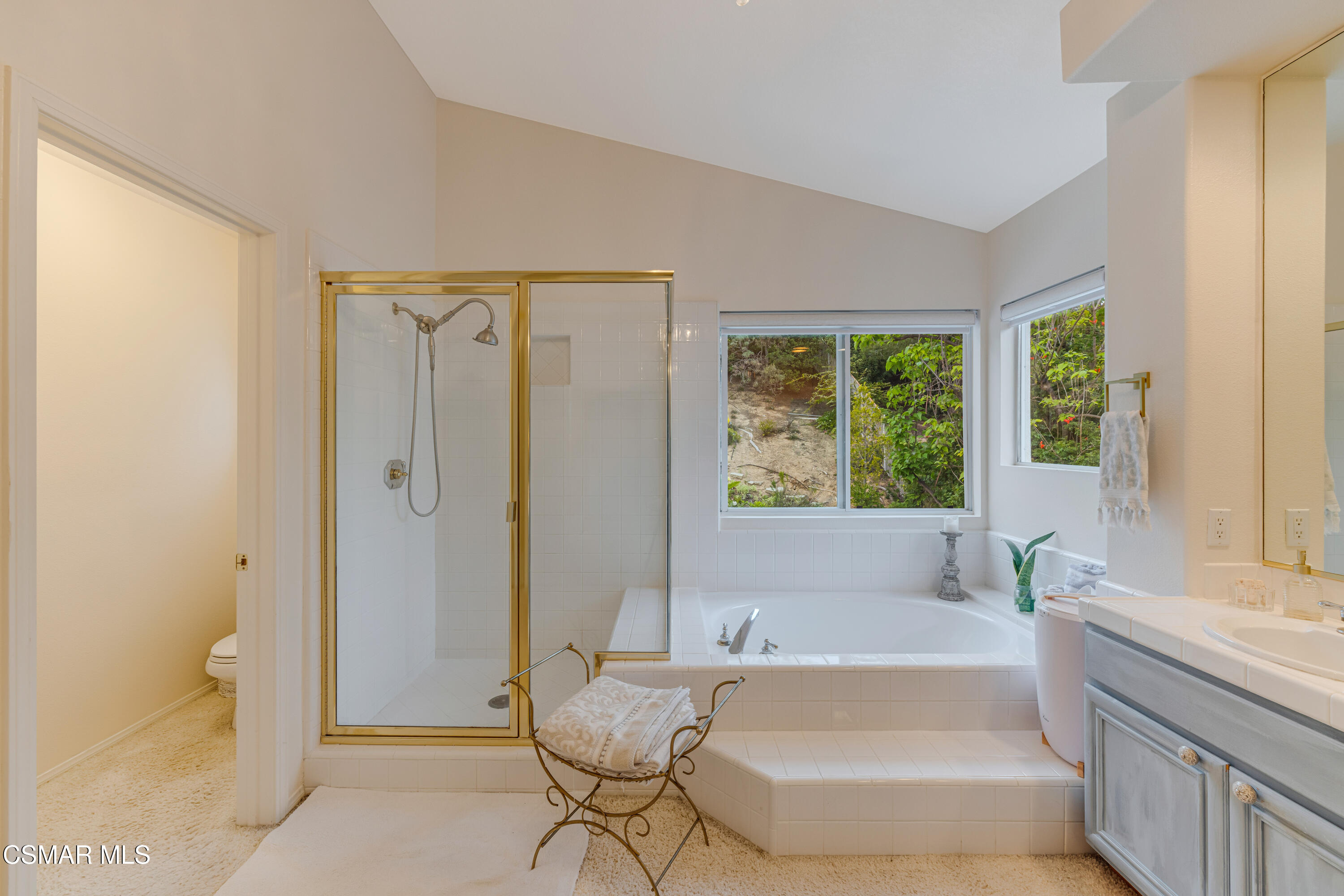 15633 Harte Lane Moorpark, CA 93021 - Photo 40 of 64 a bathroom with a tub shower and sink