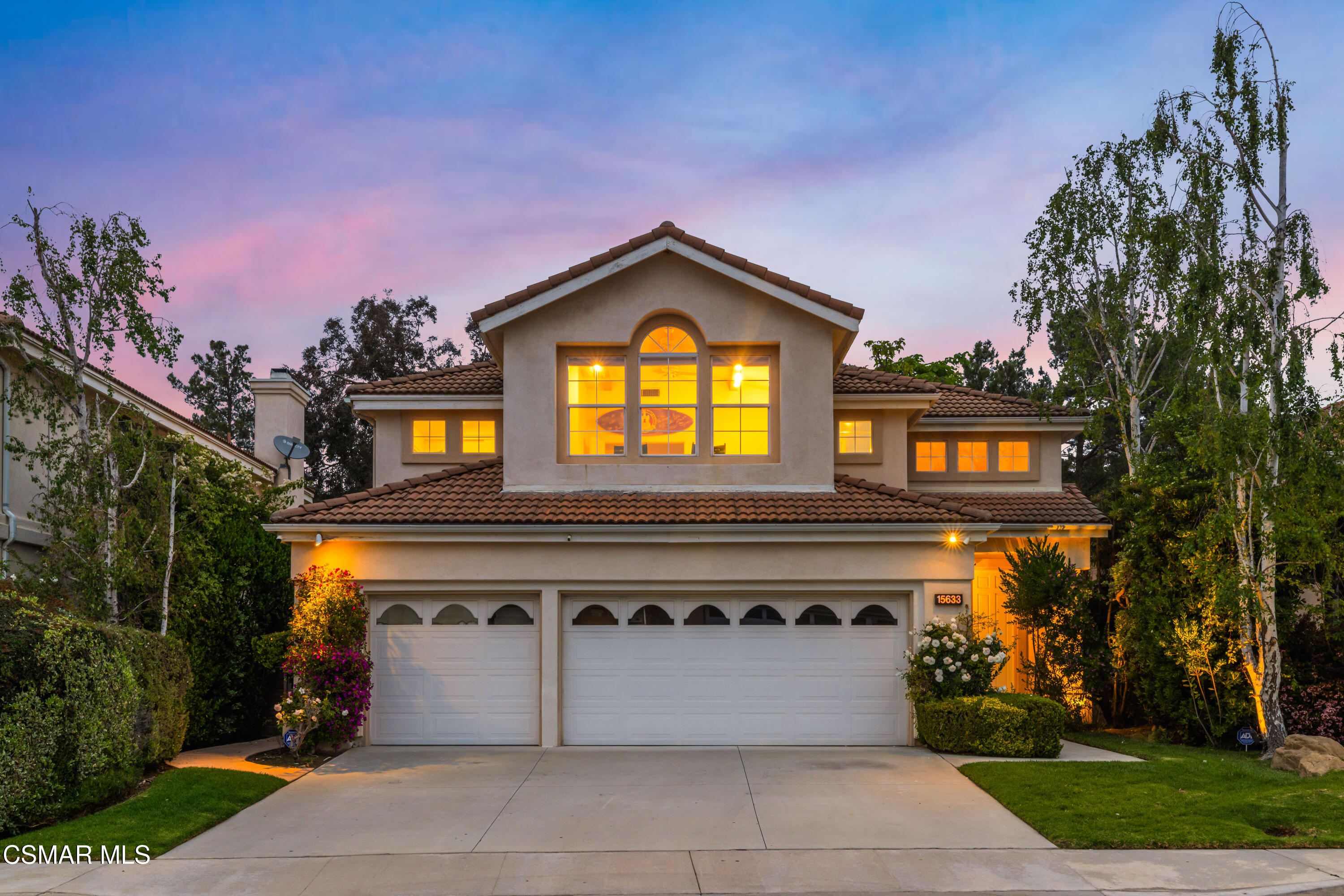 15633 Harte Lane Moorpark, CA 93021 - Photo 4 of 64 a front view of a house with a yard and a garage