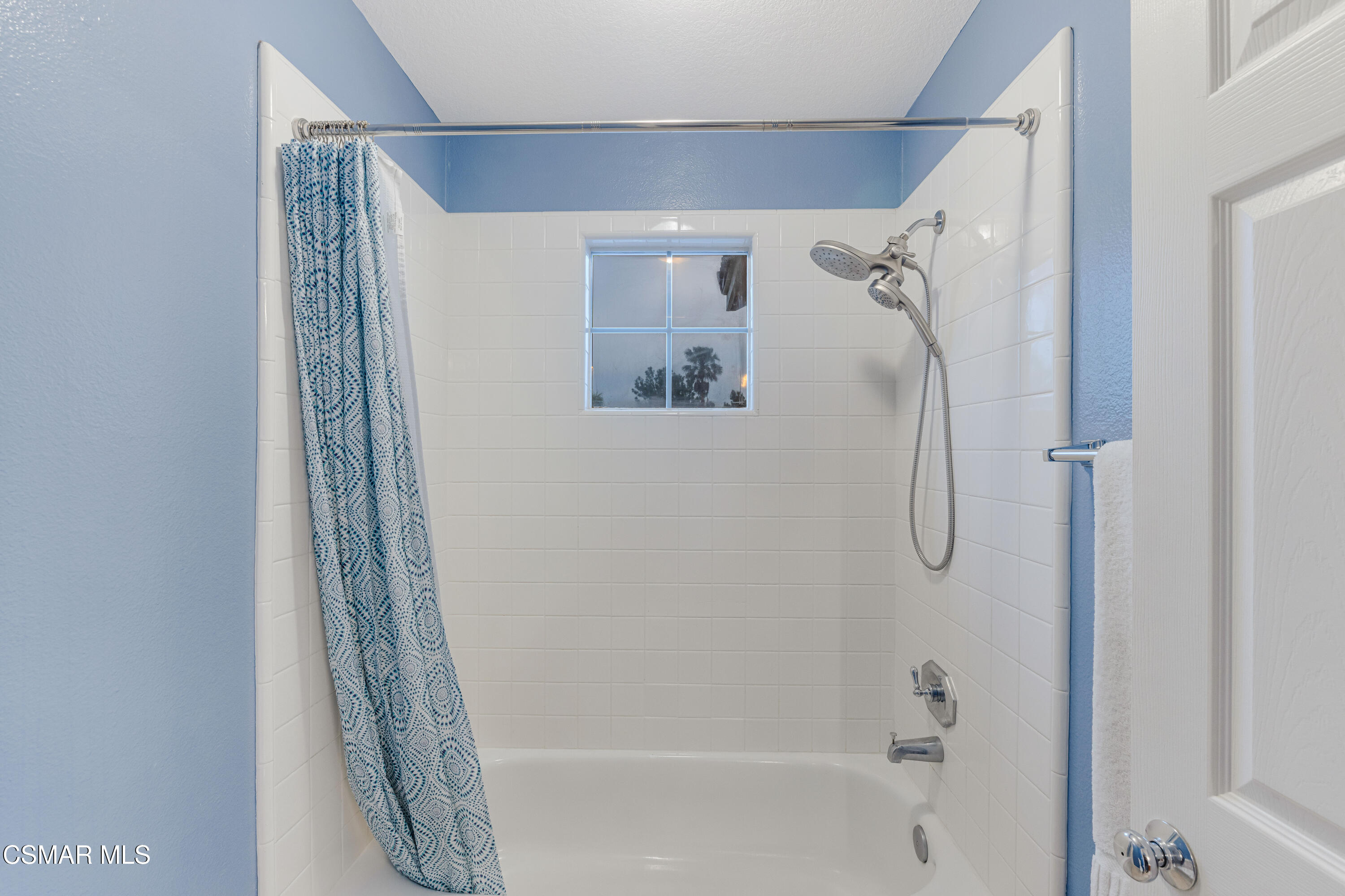 15633 Harte Lane Moorpark, CA 93021 - Photo 44 of 64 a bathroom with a shower and a glass door
