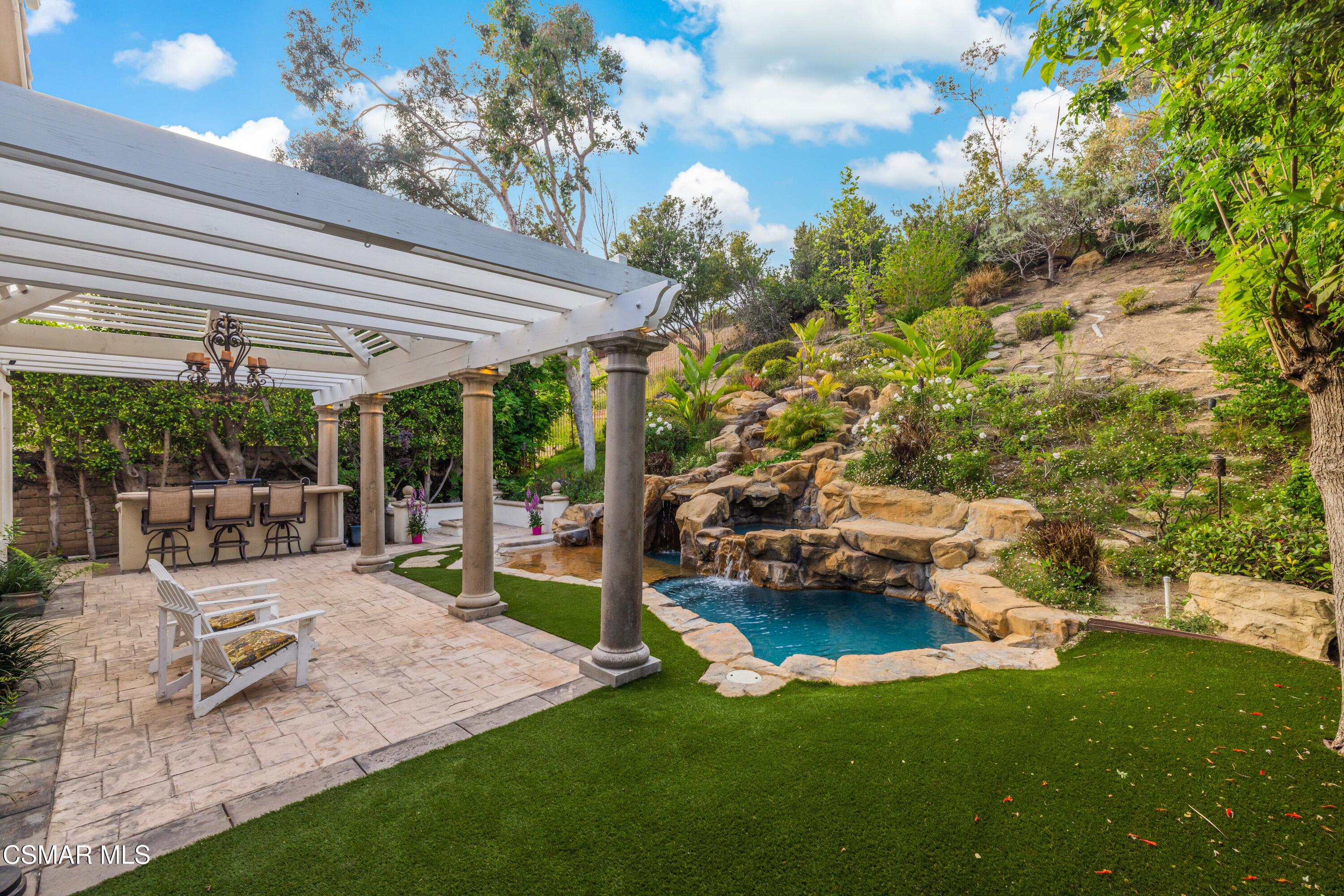 15633 Harte Lane Moorpark, CA 93021 - Photo 49 of 64 a view of a house with backyard porch and sitting area
