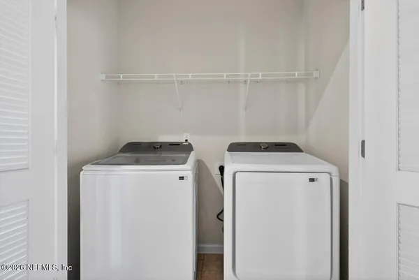 a utility room with dryer and washer