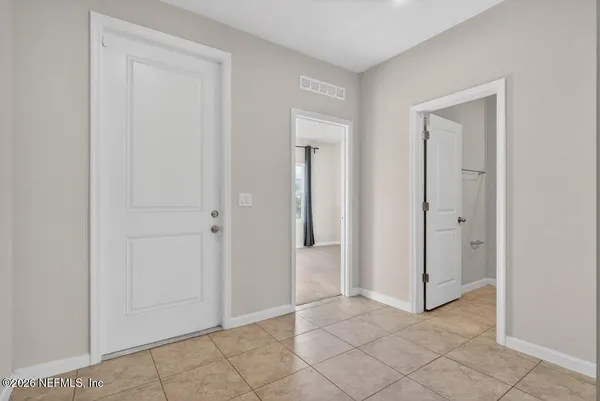 an empty room with closet area