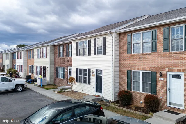 a view of a house with backyard porch and sitting area