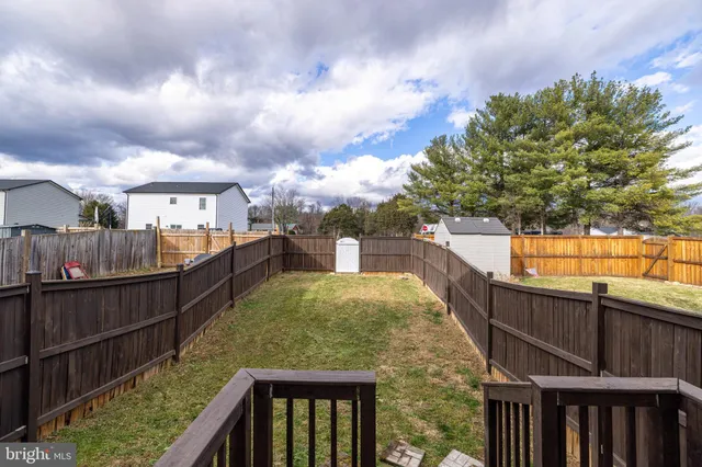 a view of a balcony with two chairs