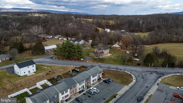 an aerial view of a house having yard